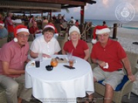 Santa delivers at the Divi to the Clown Doctors of Aruba, image # 11, The News Aruba