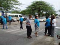 The members and staff of FAVI stop traffic for 
