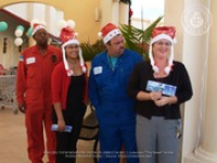 Valero and Meals on Wheels volunteers join together for a shopping spree at Ling & Sons, image # 2, The News Aruba