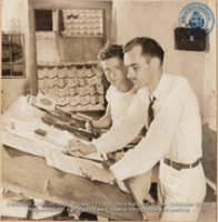 Preparation of ARUBA ESSO NEWS - Bob Schlageter, Editor, and Dutch Type Setter (#4673, Lago , Aruba, April-May 1944), Morris, Nelson