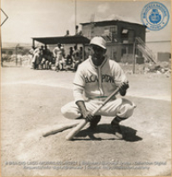 Baseball game at Aruba Sports Park in San Nicholas between team from Lago Garage and the Puerto Rican soldiers guarding the plant (#5257, Lago , Aruba, April-May 1944), Morris, Nelson