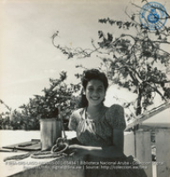 Young Aruban girl drawing water from well next to house (#5434, Lago , Aruba, April-May 1944), Morris, Nelson