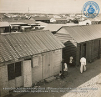 Slums of San Nicholas, adjoining Refinery (#8908, Lago , Aruba, April-May 1944), Morris, Nelson