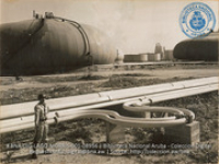 Soldier guarding tank farm and loading lines (#8956, Lago , Aruba, April-May 1944), Morris, Nelson