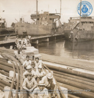Dock hands riding Lago Oil & Transport Company Railroad at Lake tanker dock (#8988, Lago , Aruba, April-May 1944), Morris, Nelson