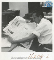 Lago Employee reading Trinidad Guardian during Lunchtime (Human Interest / People at Work, LAGO, July 1957), Lago Oil and Transport Co. Ltd.