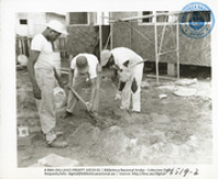 Volunteers converting a surplus LAGO bunkhouse into community housing (Human Interest / People at Work, LAGO, April 1957), Lago Oil and Transport Co. Ltd.