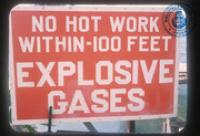 No hot work within 100 feet - Explosive gases (Safety Sign, Lago, ca. 1965), Lago Oil and Transport Co. Ltd.