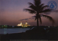 Cruise ships light up the Aruba shoreline, with their dazzling array of lights (Postcard, ca. 1976)