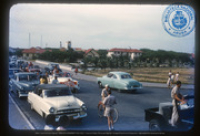 Gasparito de 1ste [Capi/Casper Lacle], Prins Carnaval 1955, in open auto. Brug Lagoen, Oranjestad, Aruba, De Windt, C.L.L.