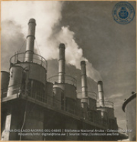 Cotterell Precipitators - Smoke emanating from last stack is escaping gases from concentrators without electricity in the precipator (#4845, Lago , Aruba, April-May 1944), Morris, Nelson