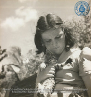 Young American girl of Colony in garden of one of the Bungalows (#5049, Lago , Aruba, April-May 1944), Morris, Nelson