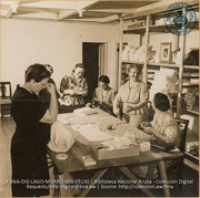 The Dutch 'womens' group of the Princess Irene Committee meets to cut out patterns which the American ladies sew up later in the week (#5130, Lago , Aruba, April-May 1944), Morris, Nelson