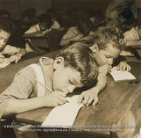 First Graders learning to write (#5384, Lago , Aruba, April-May 1944), Morris, Nelson