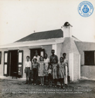 The Feliciano family showing father who works as a Mason in Refinery, and Raymundo who is apprentice boy (#5469, Lago , Aruba, April-May 1944), Morris, Nelson