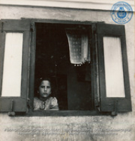 Young Aruban child, sister of Raymundo Feliciano, at window (#5471, Lago , Aruba, April-May 1944), Morris, Nelson