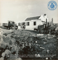 House of the Narvas family, showing truck which Mr. Narvas uses to transport himself and neighboring workers to Lago (#5479, Lago , Aruba, April-May 1944), Morris, Nelson