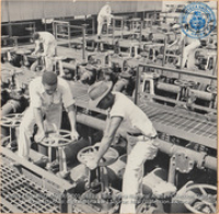 Opening the flow lines at the crude pumphouse; these lines are connected with the lake tankers (#8821, Lago , Aruba, April-May 1944), Morris, Nelson
