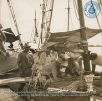 Scenes of Oranjestad harbor; showing sailors and schooners which transport fruit and fish from Venezuela and Dominican Republic (#8875, Lago , Aruba, April-May 1944), Morris, Nelson