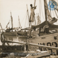 Scenes of Oranjestad harbor; showing sailors and schooners which transport fruit and fish from Venezuela and Dominican Republic (#8877, Lago , Aruba, April-May 1944), Morris, Nelson
