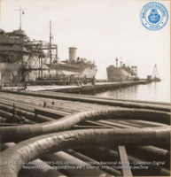 Loading lines at ocean-going tanker dock (#8983, Lago , Aruba, April-May 1944)