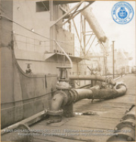 Pump line carrying crude from lake tanker (#12011, Lago , Aruba, April-May 1944)
