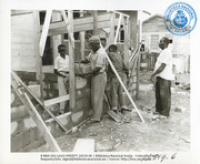 Volunteers converting a surplus LAGO bunkhouse into community housing (Human Interest / People at Work, LAGO, April 1957), Lago Oil and Transport Co. Ltd.