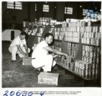 S. Osefia and A. Croes, Lago Commissary (Human Interest / People at Work, LAGO, February 1961), Lago Oil and Transport Co. Ltd.