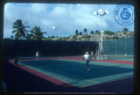Help us describe this picture! (Tennis at the Club, Lago, ca. 1982), Lago Oil and Transport Co. Ltd.