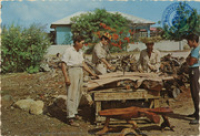Woodworkers crafting the famous Aruban 'kwihi' tables by hand (Postcard, ca. 1966)
