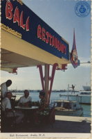 Bali Restaurant, Aruba, Netherlands Antilles (Postcard, ca. 1969) This famous restaurant, on Oranjestad's colorful waterfront, offers diners a delightful view of the harbor. Indonesian dishes are featured