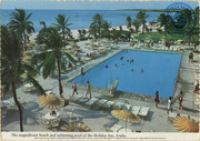 The magnificent beach and swimming pool of the Holiday Inn, Aruba (Postcard, ca. 1971) Located on beautiful Palm Beach, Aruba, the elegant Holiday Inn, a first class resort hotel, has one of the most attractive beaches of this island, an olympic swimming pool, night club and casino.