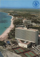 Aruba's famous Palm Beach, with luxury hotels (Postcard, ca. 1980-1986)